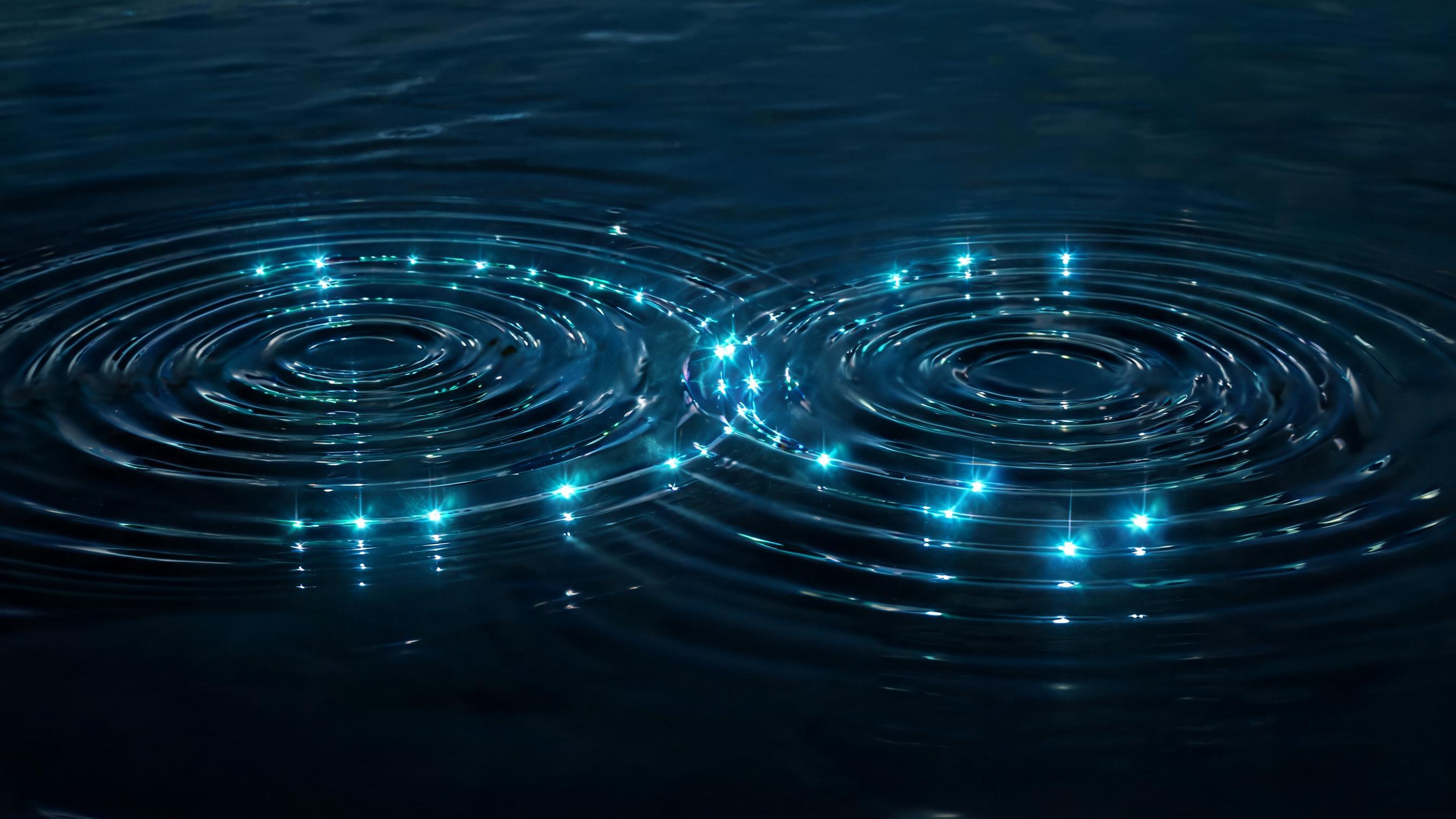 Two intersecting ripple systems on a dark liquid surface, with luminous peaks at crossings; varying ripple densities represent different companies' page matrix limits.
